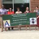 Admin and counselors holding RAMP banner